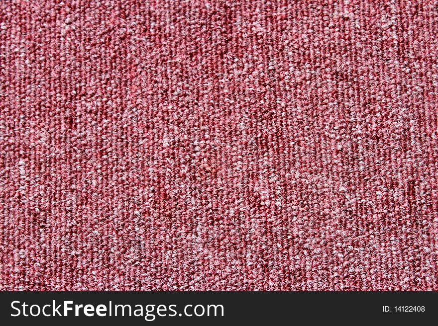 A background of a knitted floor carpet.Interior design. A background of a knitted floor carpet.Interior design.