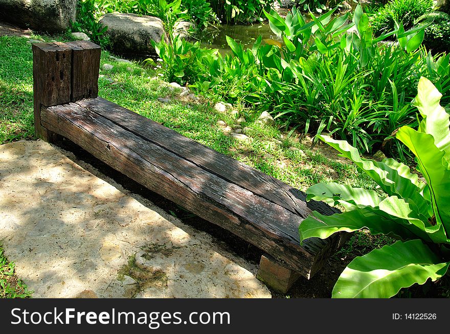 Wooden bench in garden, Thailand