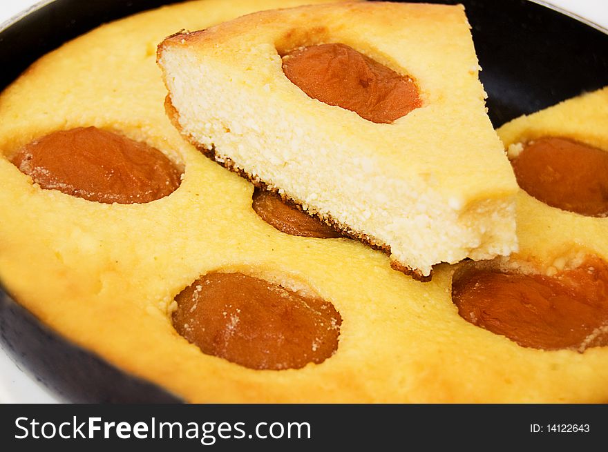 Baked pudding with apricot on frying pan