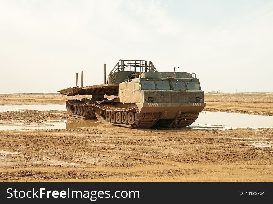 A powerful army truck all-terrain vehicle. Close-up. Day. A powerful army truck all-terrain vehicle. Close-up. Day.