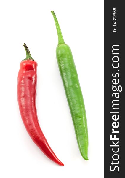 Green and red chili peppers on white background