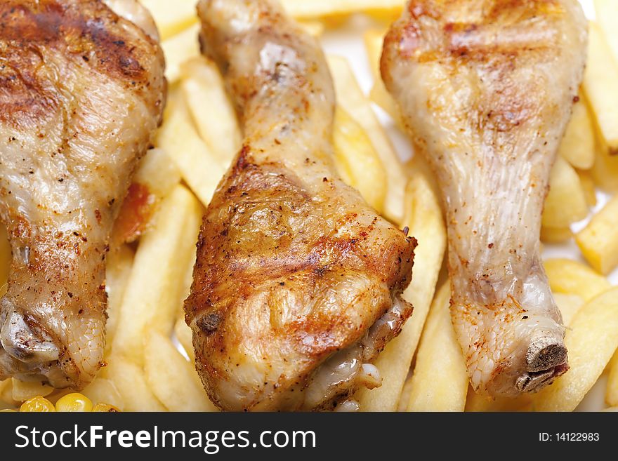 Grilled chicken leg and chips