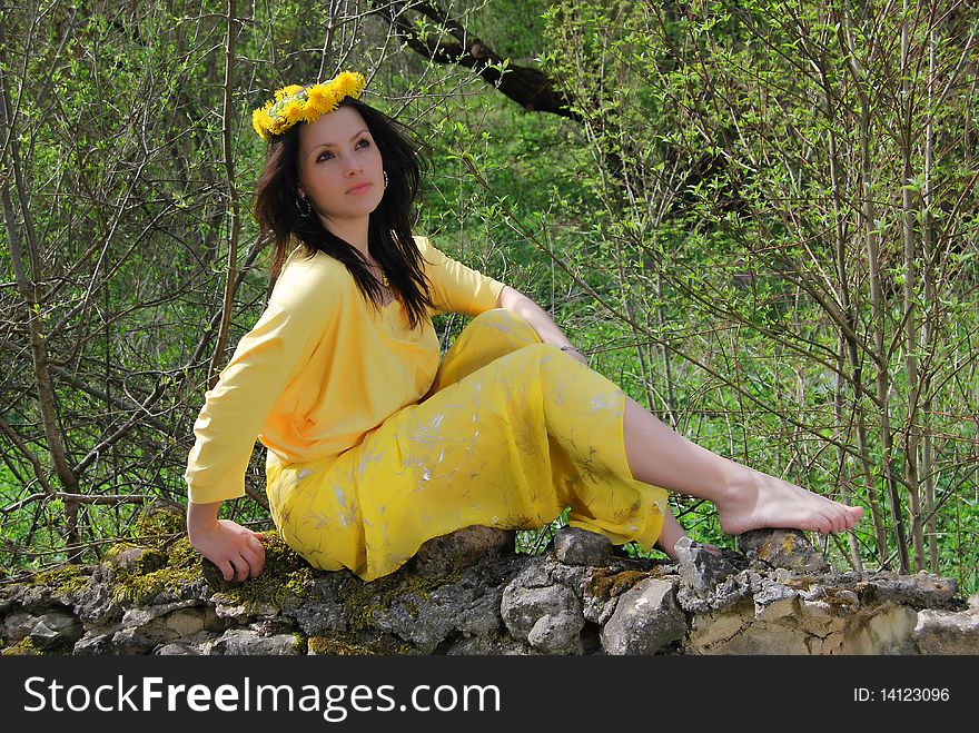 The beautiful girl walks on a solar meadow