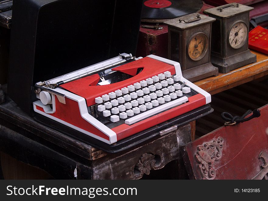 This photo shows a red typewriter in a flea market, taken on May 2, 2010 in Xiamen, China. This photo shows a red typewriter in a flea market, taken on May 2, 2010 in Xiamen, China.