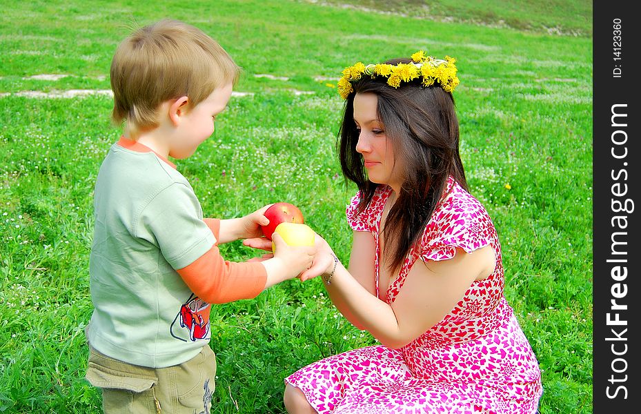 Mum and the son on a walk in a park