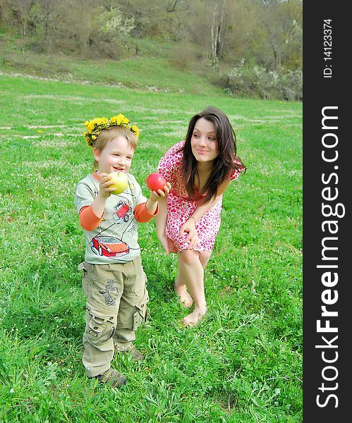 Mum and the son on a walk in a park