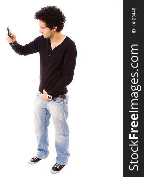 Young casual man using a cellphone to take a picture, isolated on white. Young casual man using a cellphone to take a picture, isolated on white