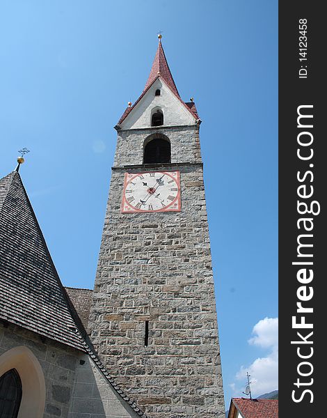 Bell tower of a church in alpes