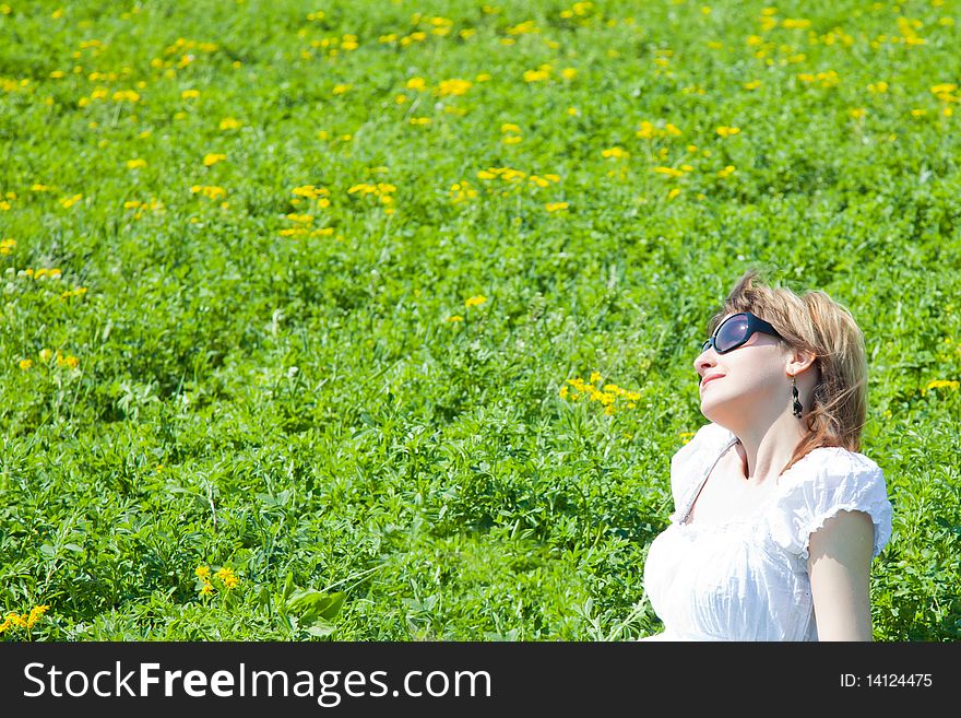 Beautiful young woman enjoying a sunny day outside. Beautiful young woman enjoying a sunny day outside