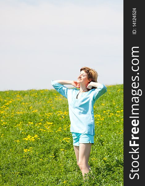 Beautiful young woman enjoying a sunny day of spring in the nature. Beautiful young woman enjoying a sunny day of spring in the nature