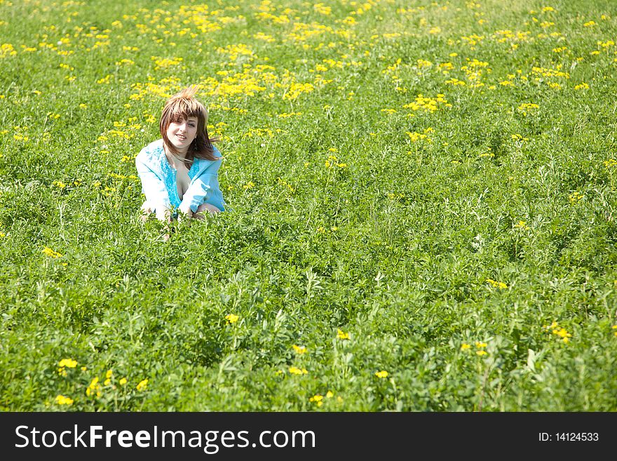 Beautiful young woman enjoying a sunny day of spring in the nature. Beautiful young woman enjoying a sunny day of spring in the nature