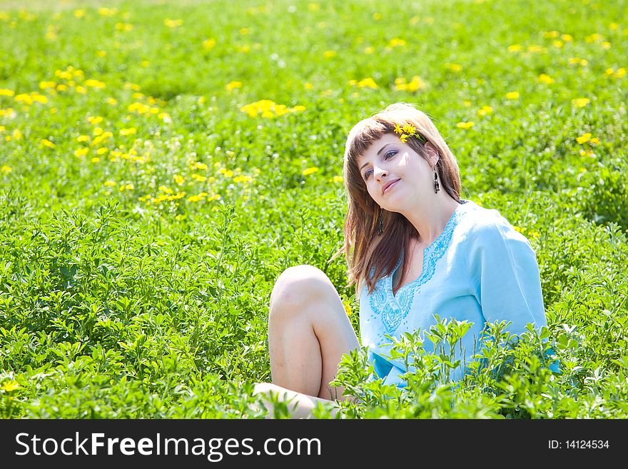 Beautiful young woman enjoying a sunny day of spring in the nature. Beautiful young woman enjoying a sunny day of spring in the nature