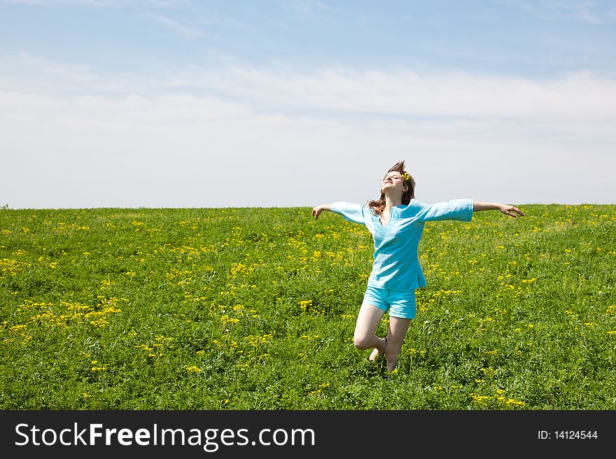 Beautiful young woman enjoying a sunny day of spring in the nature. Beautiful young woman enjoying a sunny day of spring in the nature