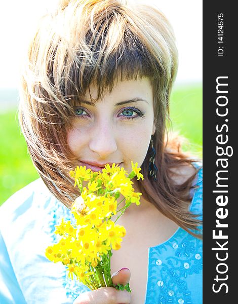 Beautiful young woman enjoying a sunny day of spring in the nature. Beautiful young woman enjoying a sunny day of spring in the nature