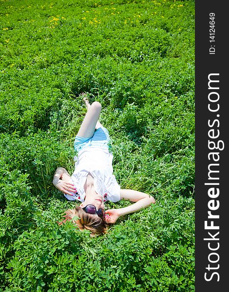 Beautiful young woman enjoying a sunny day of spring in the nature. Beautiful young woman enjoying a sunny day of spring in the nature