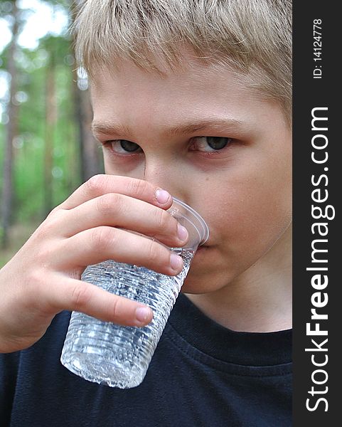 Water.Teenager Drinks From Can.