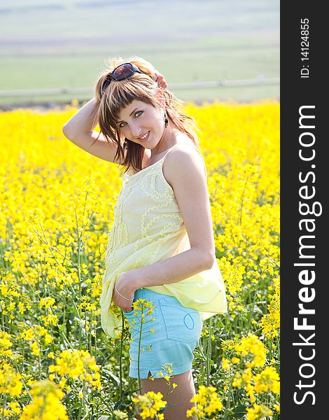 Girl in a rapeseed field