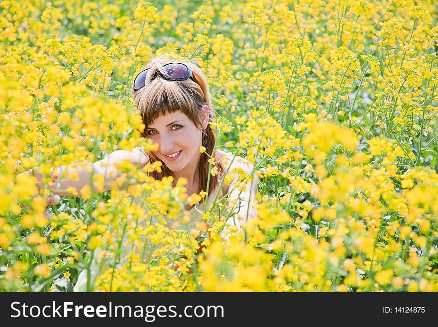 Girl in a rapeseed field