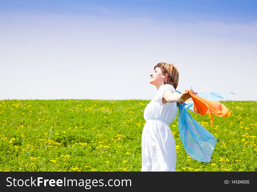 Young woman enjoying the nature in a warm spring day