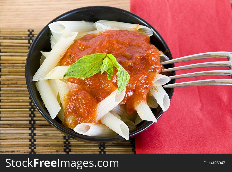 Closeup on a bowl with fresh rice penne. Closeup on a bowl with fresh rice penne