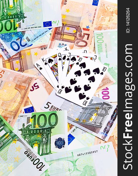 Spades cards and Euro banknotes.