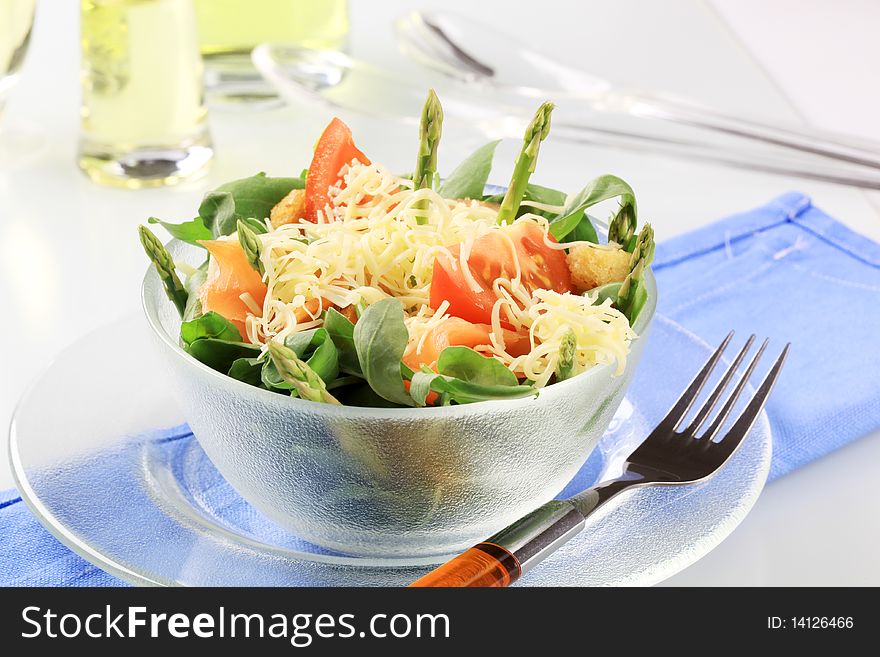 Fresh vegetable salad topped with grated cheese