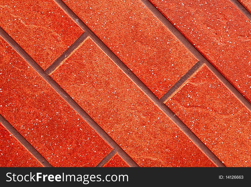 Dark red brick tile wall closeup view. Dark red brick tile wall closeup view.