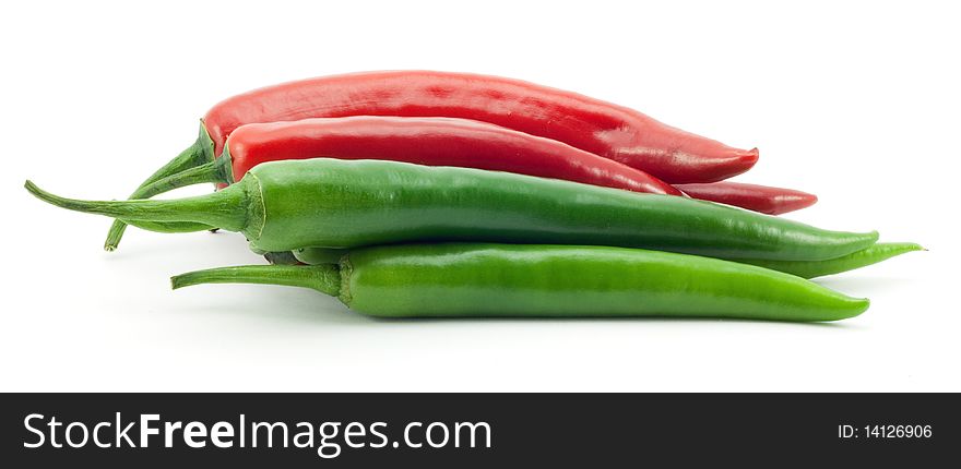 Green and red chili peppers on white background