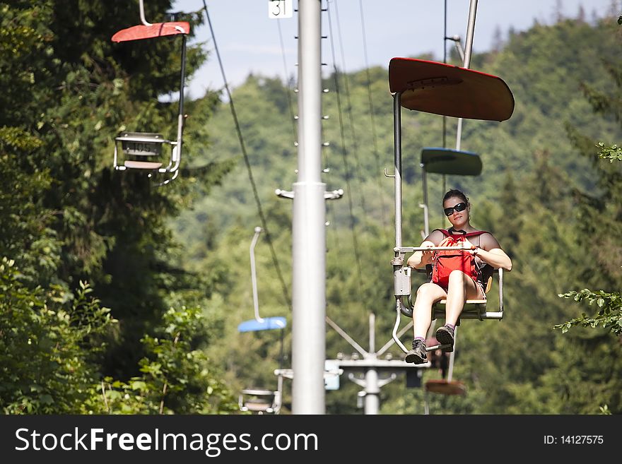 Woman on chairlift in Dedinky, Slovak Paradise