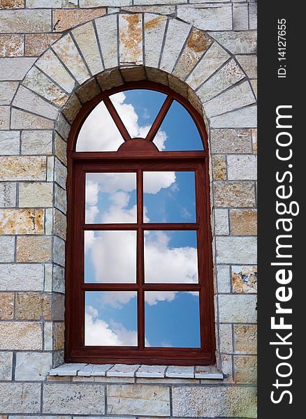 Window with Sky view in , build in wall of old bricks