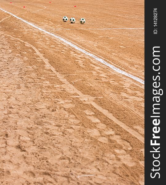 Soccer ball in a field of sand. Soccer ball in a field of sand