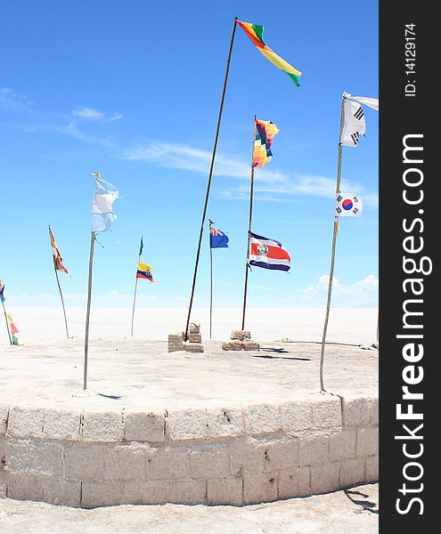 Flags of Different Nations on White Plain. Taken on the Salar de Uyuni (or Uyuni Salt Flats) in Bolivia.