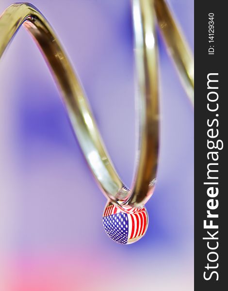 American Flag reflected in a water drop.