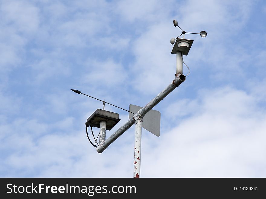 Weather instruments against a blue