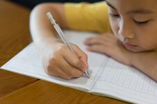 Little Boy Hand Is Writing Homework At Home. Stock Images