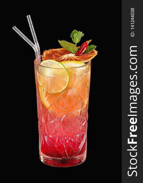 Spicy tropical alcohol cocktail with orange, lime and mint on black background with clipping path. Spicy tropical alcohol cocktail with orange, lime and mint on black background with clipping path