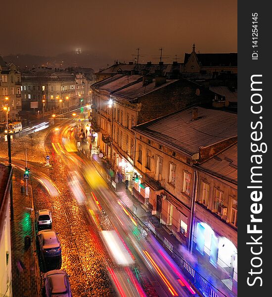 Aerial view of one of the central streets of Lviv in evening. Blurred car lights