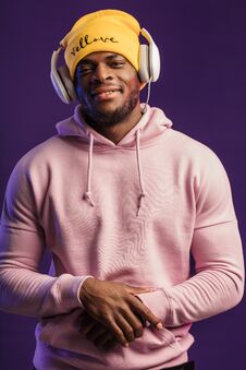 African Man In Hoodie With Headphones Isolated, Happy Expression. Music, People Royalty Free Stock Photo