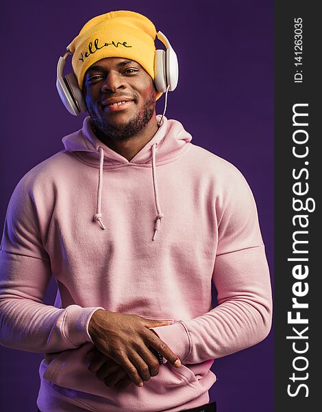 African Man In Hoodie With Headphones Isolated, Happy Expression. Music, People