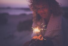 Single Attractive Woman Defocused Portrait Taking Alone Sparkles Light Fireworks To Celebrate New Year Or Party Event Outdoor In Stock Photos
