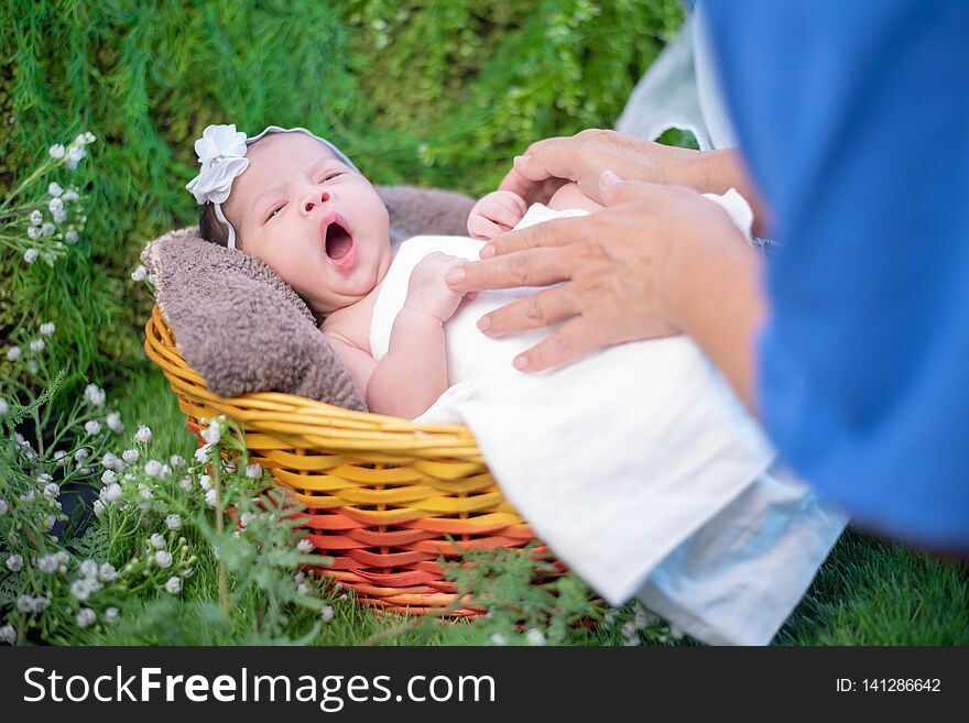 Asian newborn. Lovely kid and little child of parent. Mom with baby. Lifestyle of new family with love
