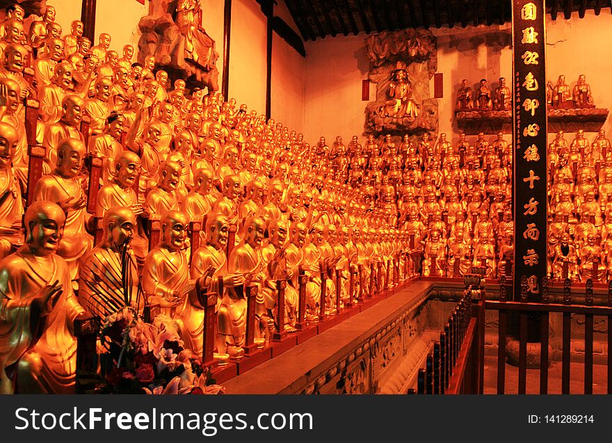Golden statues of Buddha in buddist temple