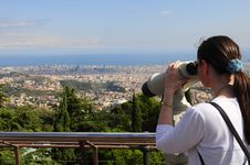 Woman Looking Through A Coin Operated Binoculars Royalty Free Stock Photography Woman Looking Through A Coin Operated Binoculars Royalty Free Stock Photography