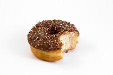 Doughnut With Bite Taken Out Over White Stock Images