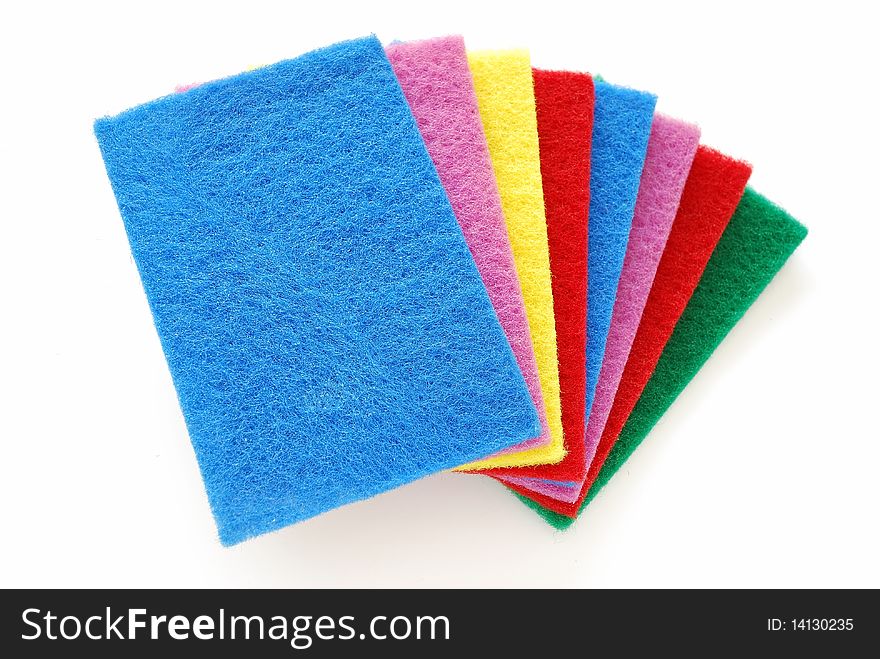 Colorful sponges used for cleaning and washing isolated on white background. For cleaning equipment and supplies. Colorful sponges used for cleaning and washing isolated on white background. For cleaning equipment and supplies.