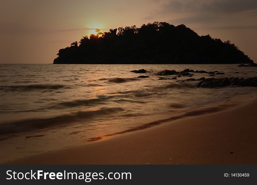 Evening scene of an island from a beach