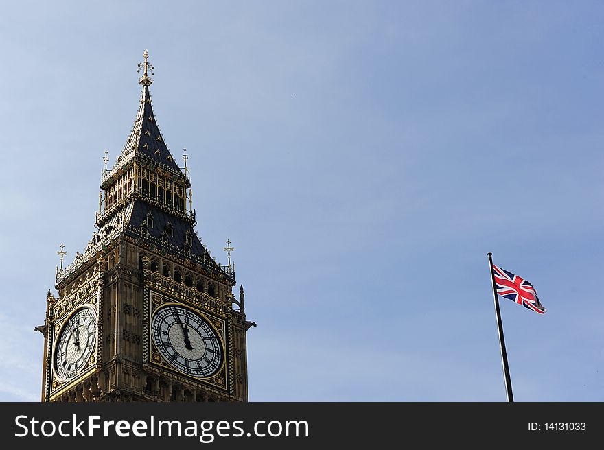 Big Ben and England Flag on Blue Sky