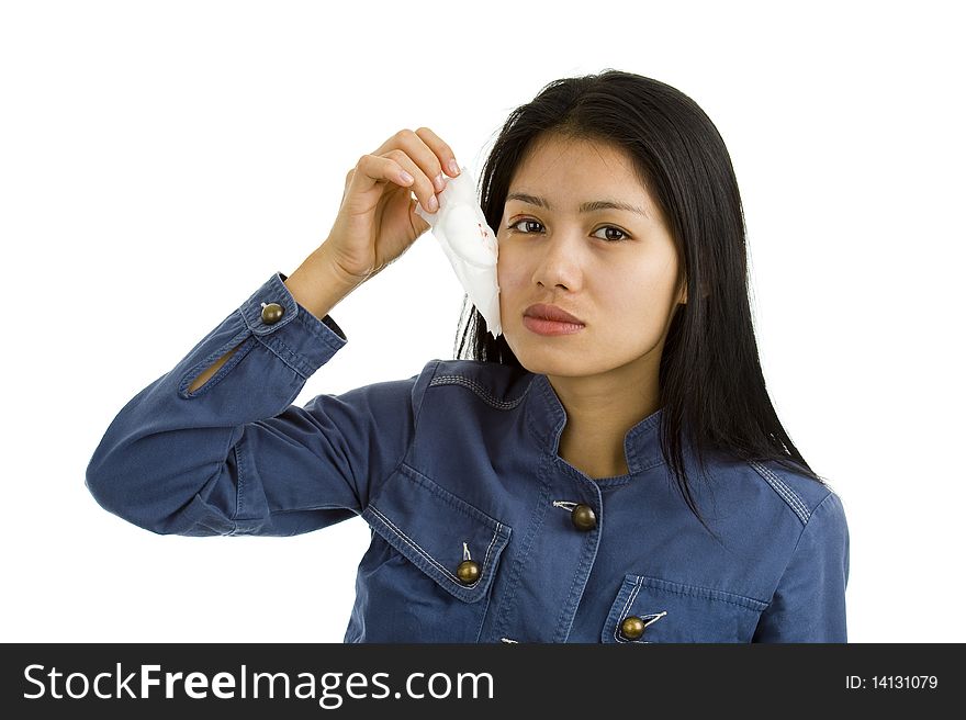 Young woman removing the bandage after eye surgery, isolated on white background. Young woman removing the bandage after eye surgery, isolated on white background