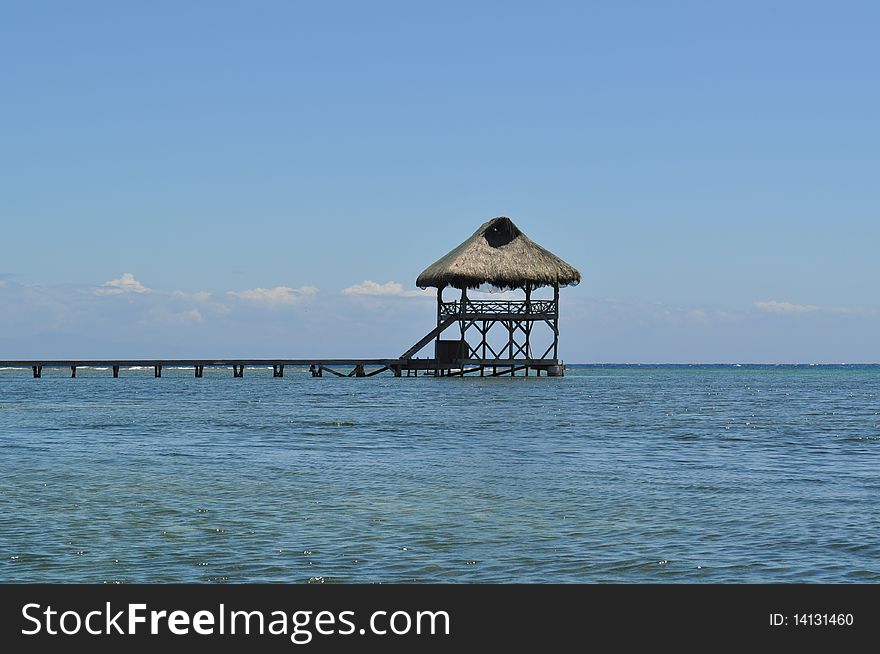 A serene view of a lookout point at the end of a pier. Taken in Roatan, Honduras. A serene view of a lookout point at the end of a pier. Taken in Roatan, Honduras.