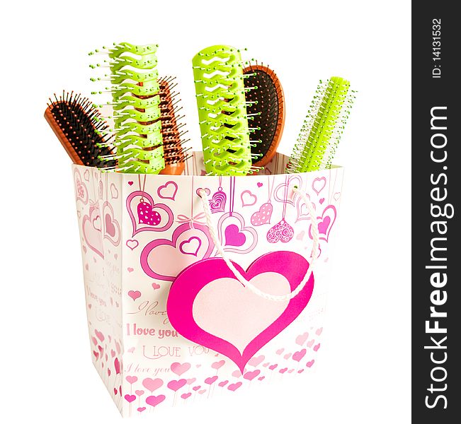 Hairbrushes in a package on a white background